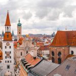 old-town-hall-surrounded-by-buildings-cloudy-sky-daytime-munich-germany (1)